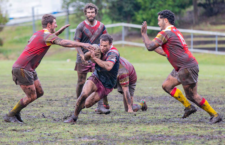 Coffs Comets players Alex Bunt and Liam Kelly close in on Nambucca’s Logan Jones.