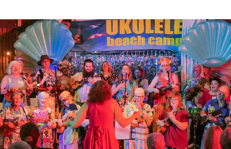 Newcastle's award-winning Ukestra conducted by Dr Jane Jelbart performing at Valla Beach. Photo: Kate Koch and Sandra Radke.