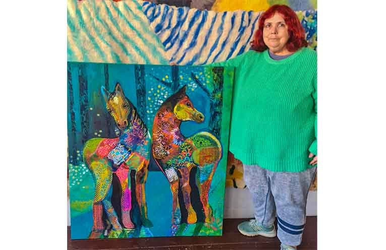 Art with Heart artist Barbara Mott with her artwork Brumbies in the Wild.