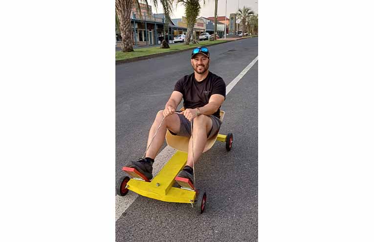 Back to Bowra Committee President Gav McKinnon test drives one of the billy carts created for Back to Bowra by Nambucca Valley Rotary.