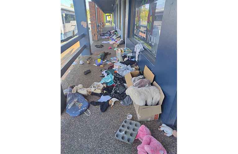 Dumped and damaged clothes outside a Vinnies Op Shop.