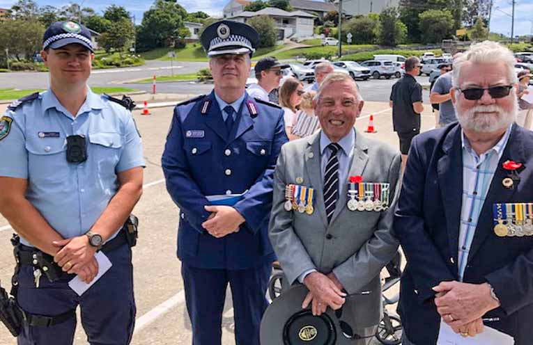 Nambucca Heads RSL sub-Branch President Denis Lane (centre) was pleased with the large attendance at the Nambucca Heads Remembrance Day service. Photo: supplied.