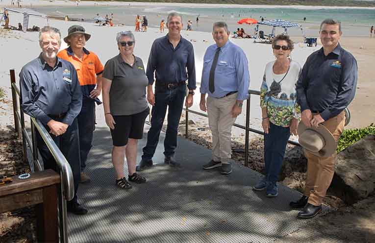 Nambucca Valley Council's Bede Spannagle, Keegan Noble, Mayor Gary Lee, Reflections Holiday’s Jackie Middleton, local resident Moira Ryan and the Scotts Head Community Group’s Tony Crimmins inspecting the new ramp at Scotts Head.