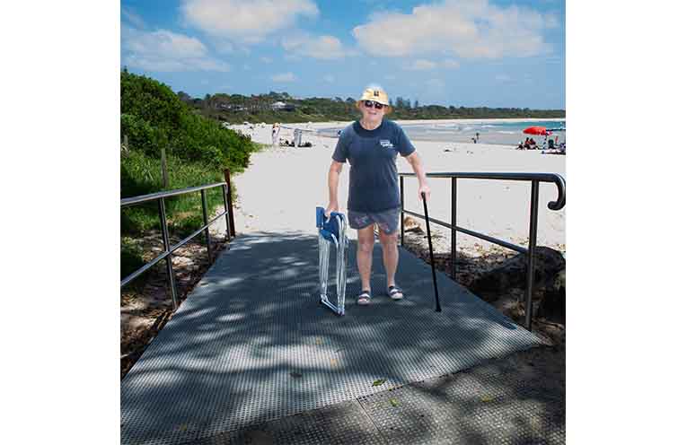 Paul West from Newcastle utilises the brand-new ramp designed to open up the beach to people of all abilities.