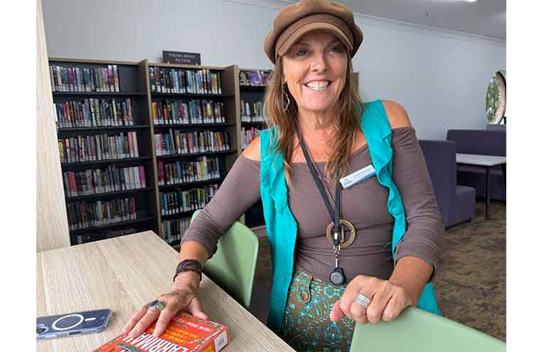 Nambucca Valley Team Leader Library Services Rowena Sierant in the new youth corner at Macksville Library, decked out with comfy bean bags, shelves of graphic novels and a high window table with bar stools. Photo: supplied.