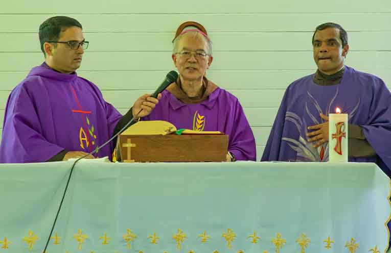 Bishop Greg Homeming is assisted by Father Peter Rebello and Father Vinod Lobo in the final Mass conducted at the Christ the King Catholic Church.