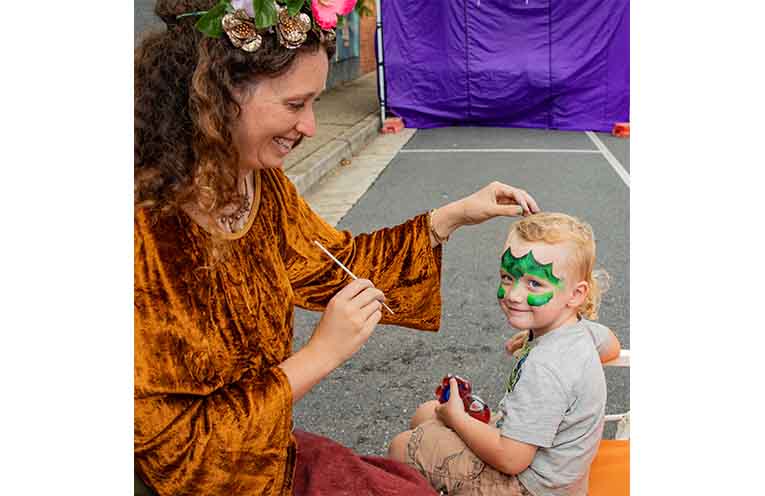 Hudson Smyth having his face painted by Grace. Photo: Mick Birtles.
