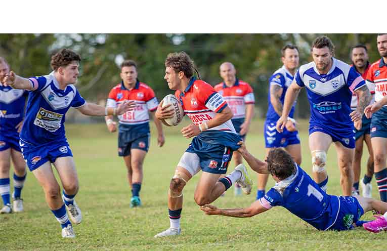 Roosters first grade’s Cameron Simon Wilson on the attack against the Grafton Ghosts during Saturday’s Round 3 clash.