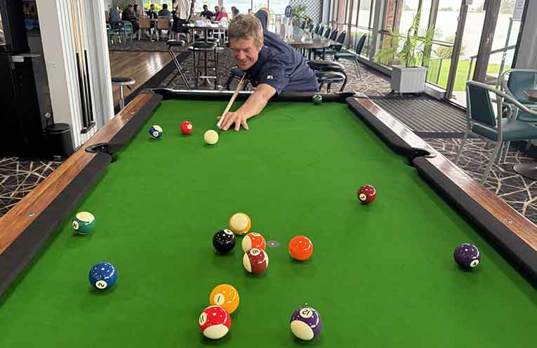 Dan Wren a picture of concentration on the new pool table at Nambucca Golf Club.