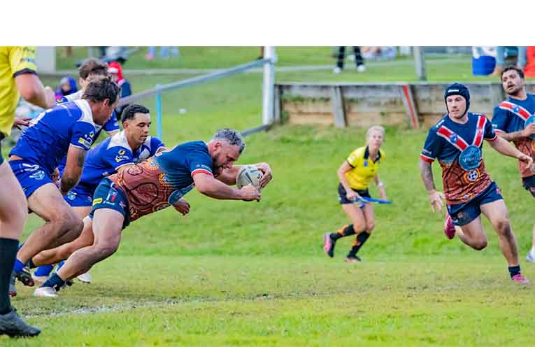 Nambucca Roosters first-grade player Brodie Simon smashes over the try-line in the latter stages of the game and seals the win for the home side.