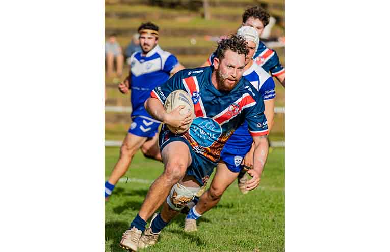 Nambucca Roosters first-grade player Zac Johnson eyes the try-line to give his side their first points of the match.