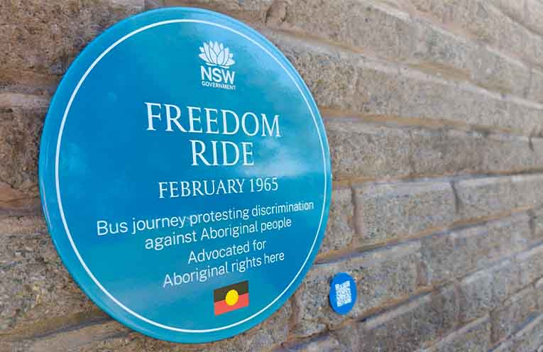 Nambucca Valley Mayor Gary Lee and Nambucca Valley Councillor Martin Ballangarry unveiling the 1965 Freedom Ride blue plaque in front of a packed High Street in Bowraville on Monday. Photo: NVC.