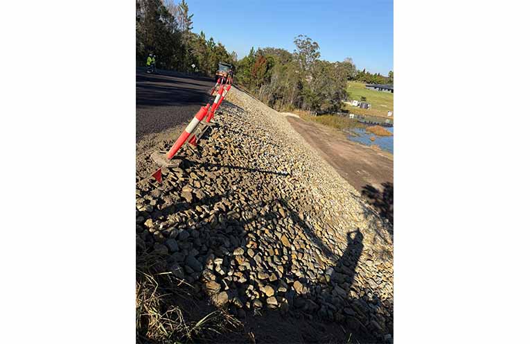 The site of a large, 70-metre landslip, adjacent to Flame Tree Road, Valla. Council’s construction contractor, ACG, has been working there for five weeks and the engineered rock-fill remediation solution and road repair is almost complete.