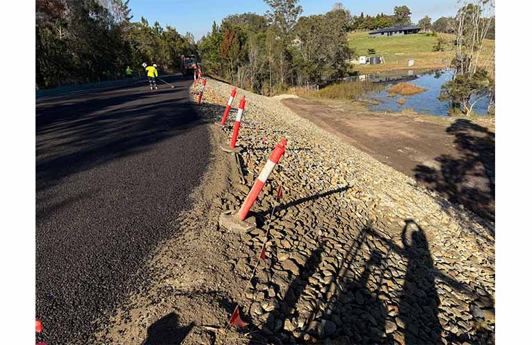 The site of a large, 70-metre landslip, adjacent to Flame Tree Road, Valla. Council’s construction contractor, ACG, has been working there for five weeks and the engineered rock-fill remediation solution and road repair is almost complete.