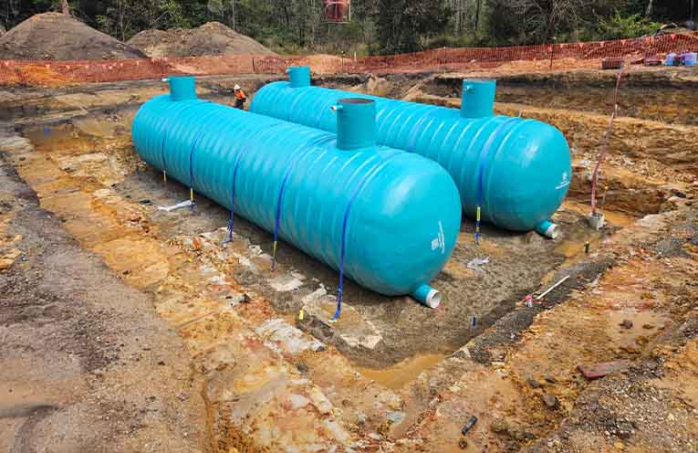 The two 15-metre-long emergency storage tanks awaiting pipe connection and back-filling. Photos: NVC.