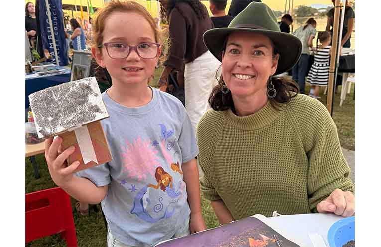 MidWaste representative Kathleen Hannah (right), led a chia house-making activity at the festival, helping about 30 children including Paige Willett. Photo: Supplied.