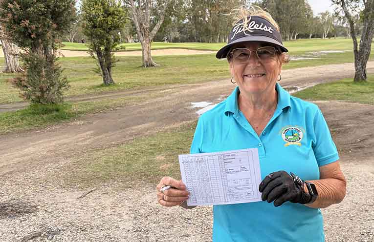 Debbie Grenenger shows off her scorecard after posting a whacking 46 stableford points at The Island on Saturday.