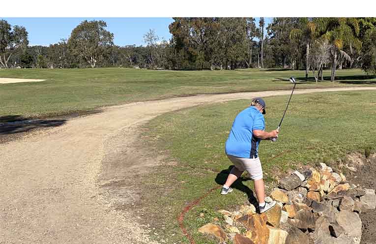 Do not try this at home, or at Nambucca golf course. Annette Hobday on the 5th. No one was injured, including the ball, as the staunch stance and swing found nothing but air.