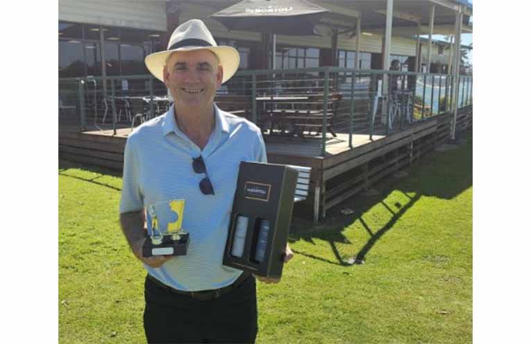 Peter Sheridan with the spoils after acing the 13th at The Island.