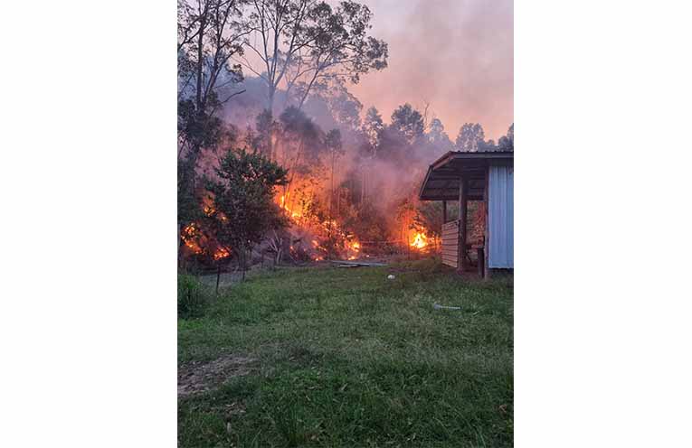 Fire safely contained behind lines at South Arm. Photo: Linda Garad.