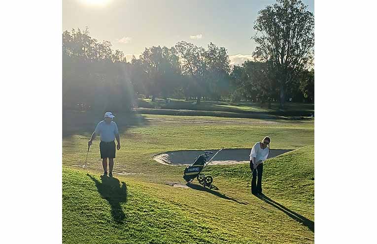 Nambucca professional Grant Rickwood has been running a coaching clinic for women interested in golf. He is seen here watching Tegan Barends play a chip shot.