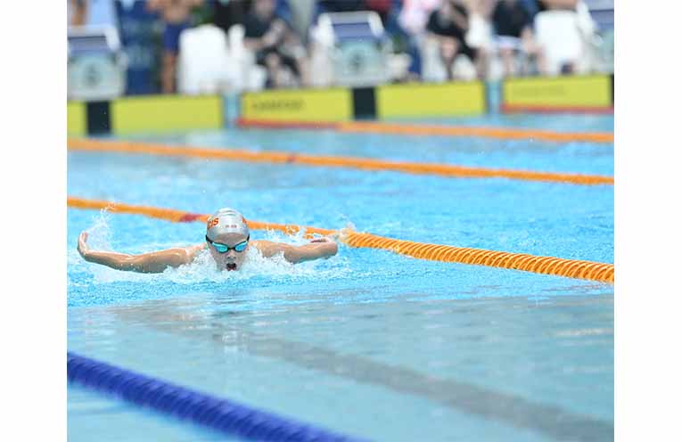 Tilly Buchholz competing in a butterfly event at the state schools titles. Photo: Buchholz family.